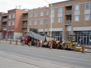 Asphalt removal and repaving in front of a residential apartment building